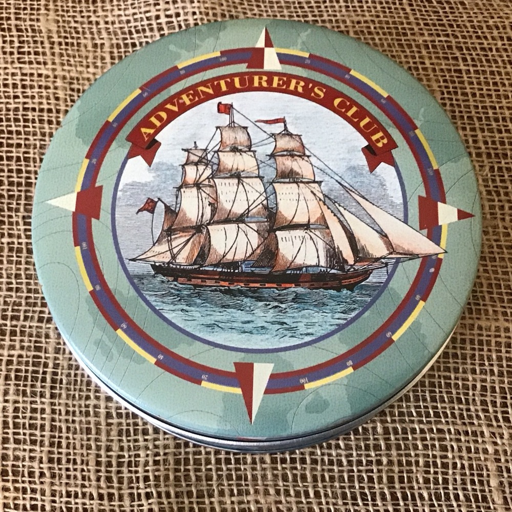 Vintage Adventurer’s Club metal tin.  Nautical ship and compass.